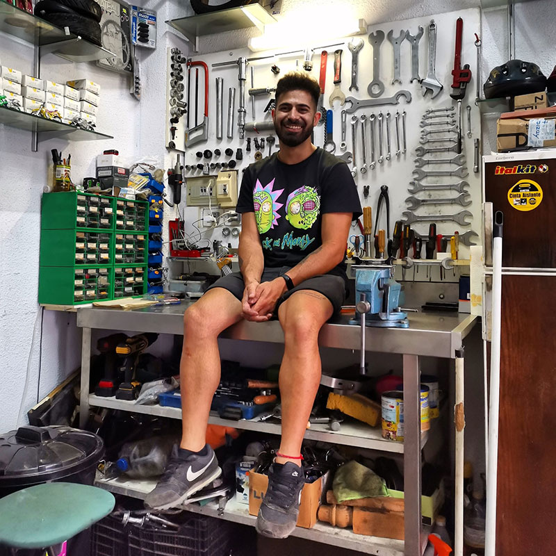 Bike mechanic in bicycle workshop in Malaga